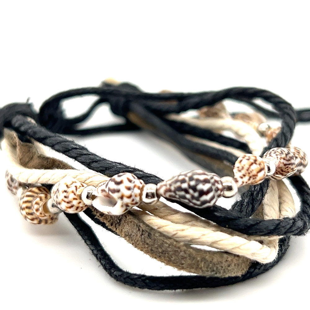 
                  
                    An earthy Rope Shell Bracelet with sea shells on an adjustable band. Perfect for everyday wear from Super Silver.
                  
                