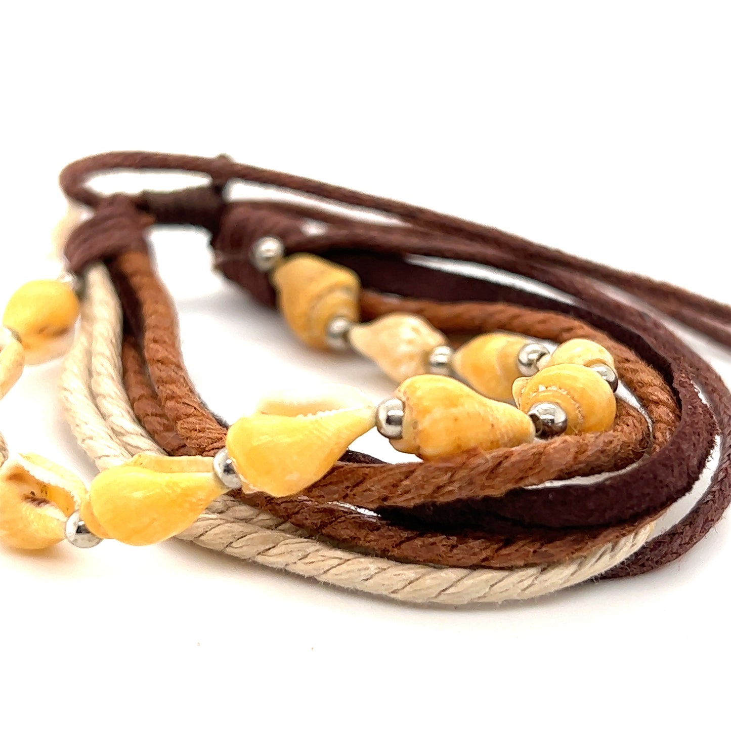 
                  
                    A Super Silver Rope Shell Bracelet with yellow and brown beads on a white background. The adjustable band makes it perfect for everyday wear.
                  
                