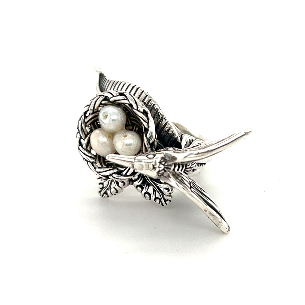 
                  
                    A Super Silver Hummingbird With Nest of Pearls Ring adorned with shimmering pearls.
                  
                