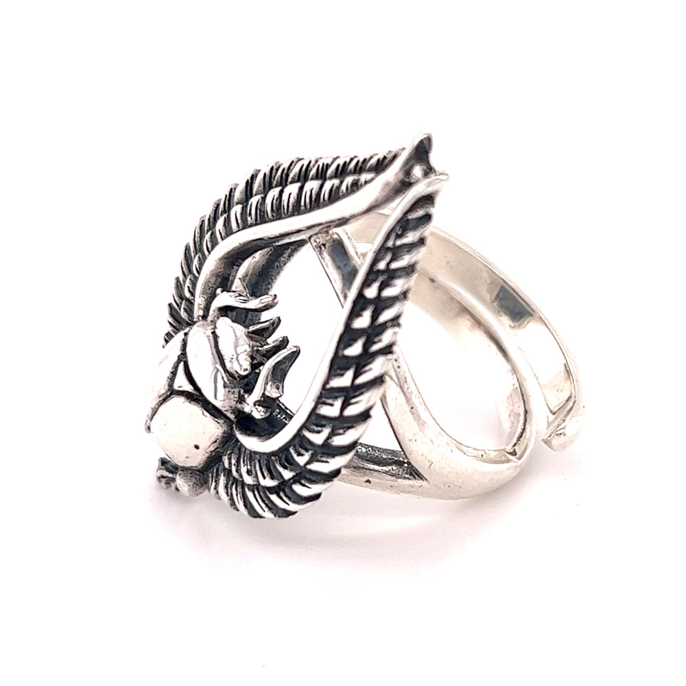 
                  
                    A bold Winged Scarab ring with a leaf statement.
                  
                