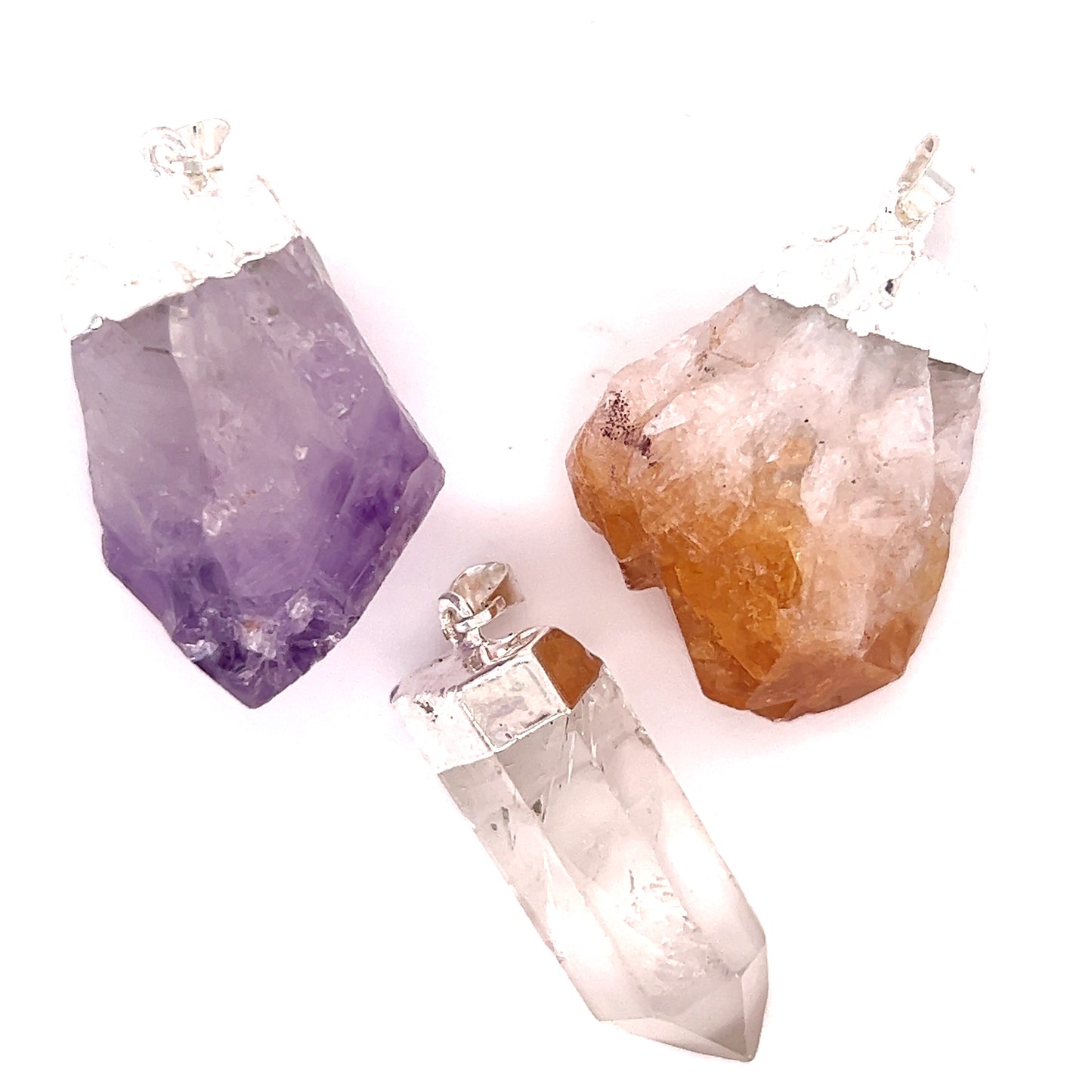 Layering amethyst crystal pendants featuring Super Silver's Raw Crystal Pendant With Silver Cap.