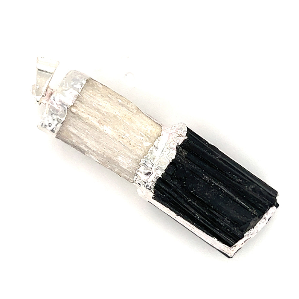 A Super Silver Tourmaline and Selenite Pendant with a black and white stone that provides cleansing energies.