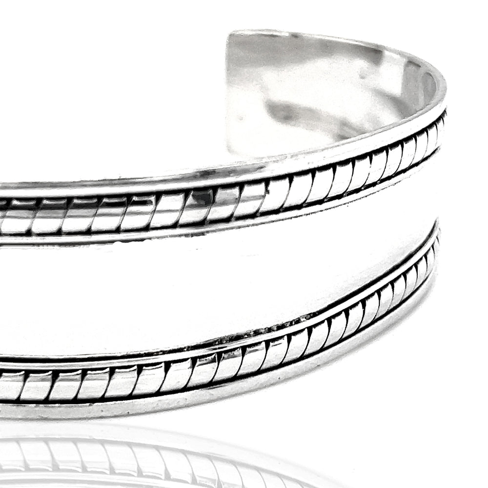 
                  
                    A Super Silver Domed Silver Cuff Bracelet with Rope Etching, perfect for everyday wear.
                  
                