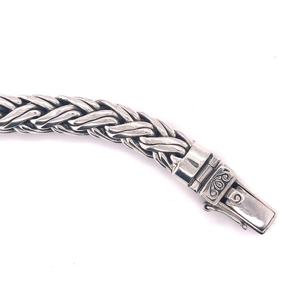 
                  
                    A Heavy Sterling Silver Braided Bracelet with a braided clasp made of .925 Sterling Silver from the Super Silver brand.
                  
                