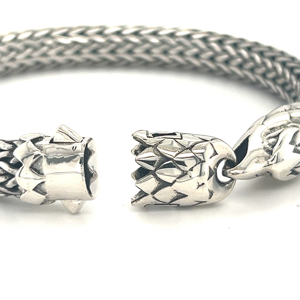 A Super Silver Heavy Braided Bracelet with Eagle Clasp with an intricate design.