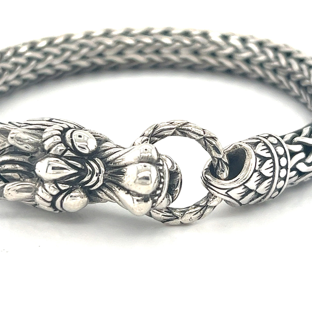 A Super Silver Sterling Silver Braided Rope Bracelet with Dragon Head with a silver dragon clasp.
