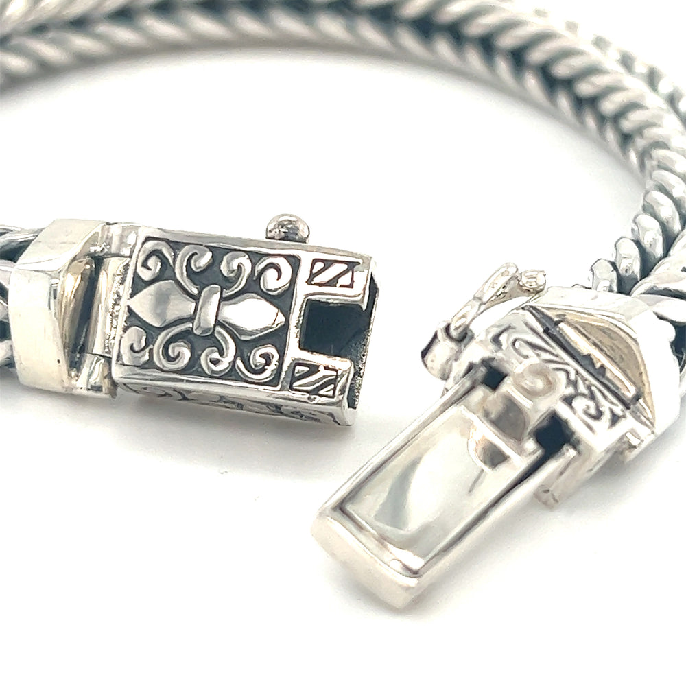 A Super Silver Heavy Braided Bracelet with an ornate clasp, made of .925 Sterling Silver.