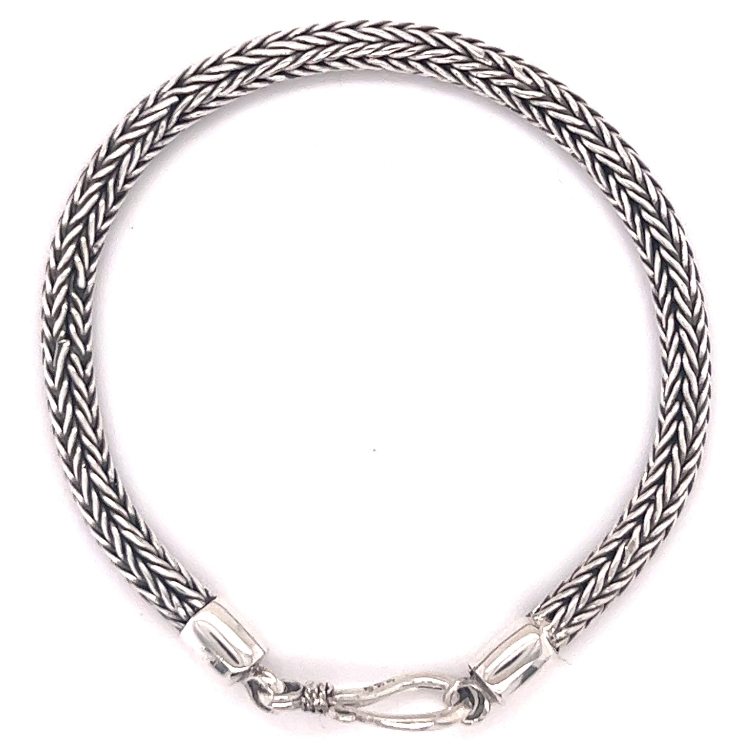 A thicker, Super Silver braided rope bracelet with a clasp and with a darkened finish.