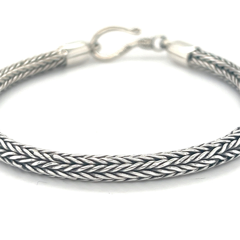 A thicker Super Silver 4mm Braided Bracelet on a white background.