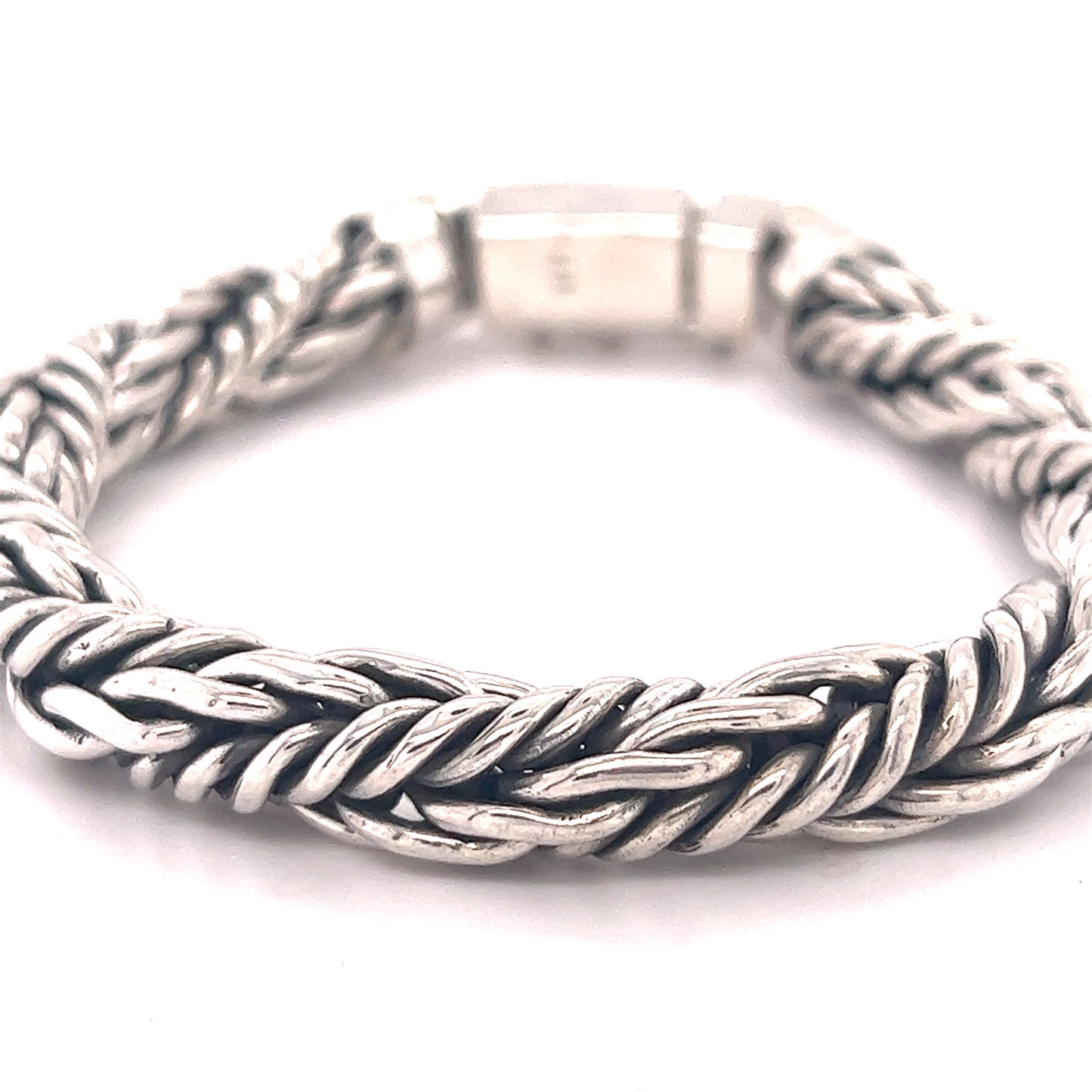 
                  
                    A Heavy Twisted Rope Bracelet with a braided design, available in various lengths, showcased on a white background by Super Silver.
                  
                