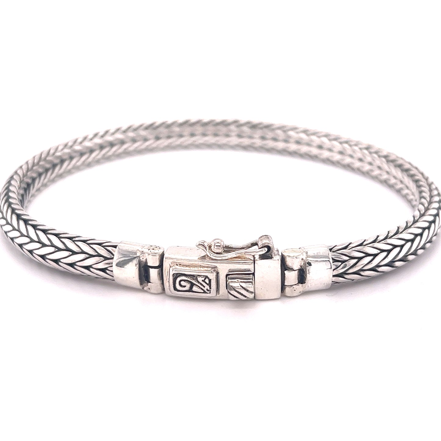 This Super Silver braided rope bracelet with a clasp offers a unique look and is comfortable to wear.