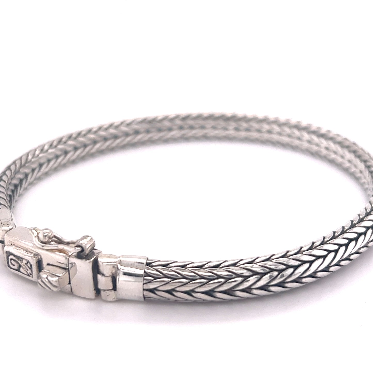 A unique Super Silver Braided Bracelet with Flat Edge, featuring a comfortable clasp.