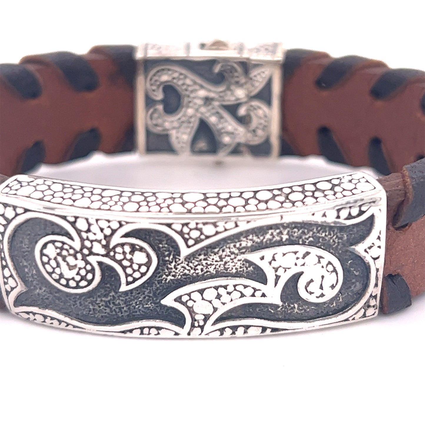
                  
                    A unique Tribal Leather Bracelet from Super Silver with an ornate design.
                  
                