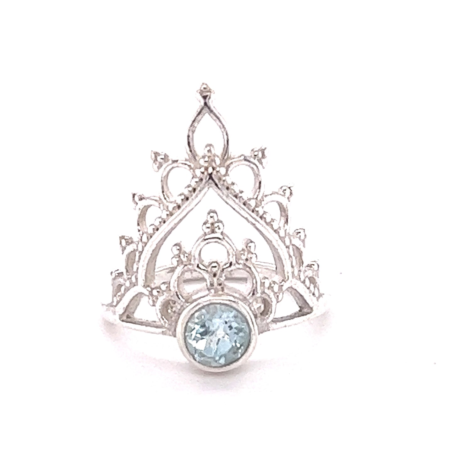 
                  
                    A Henna Crown Ring with Natural Gemstones featuring a stunning blue topaz cabochon.
                  
                