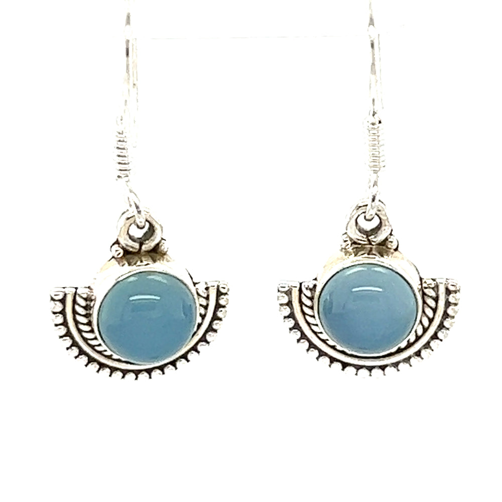 
                  
                    A pair of Super Silver Round Gemstone Earrings with Fan Setting, with blue agate stones set in a rustic silver fan-like setting.
                  
                