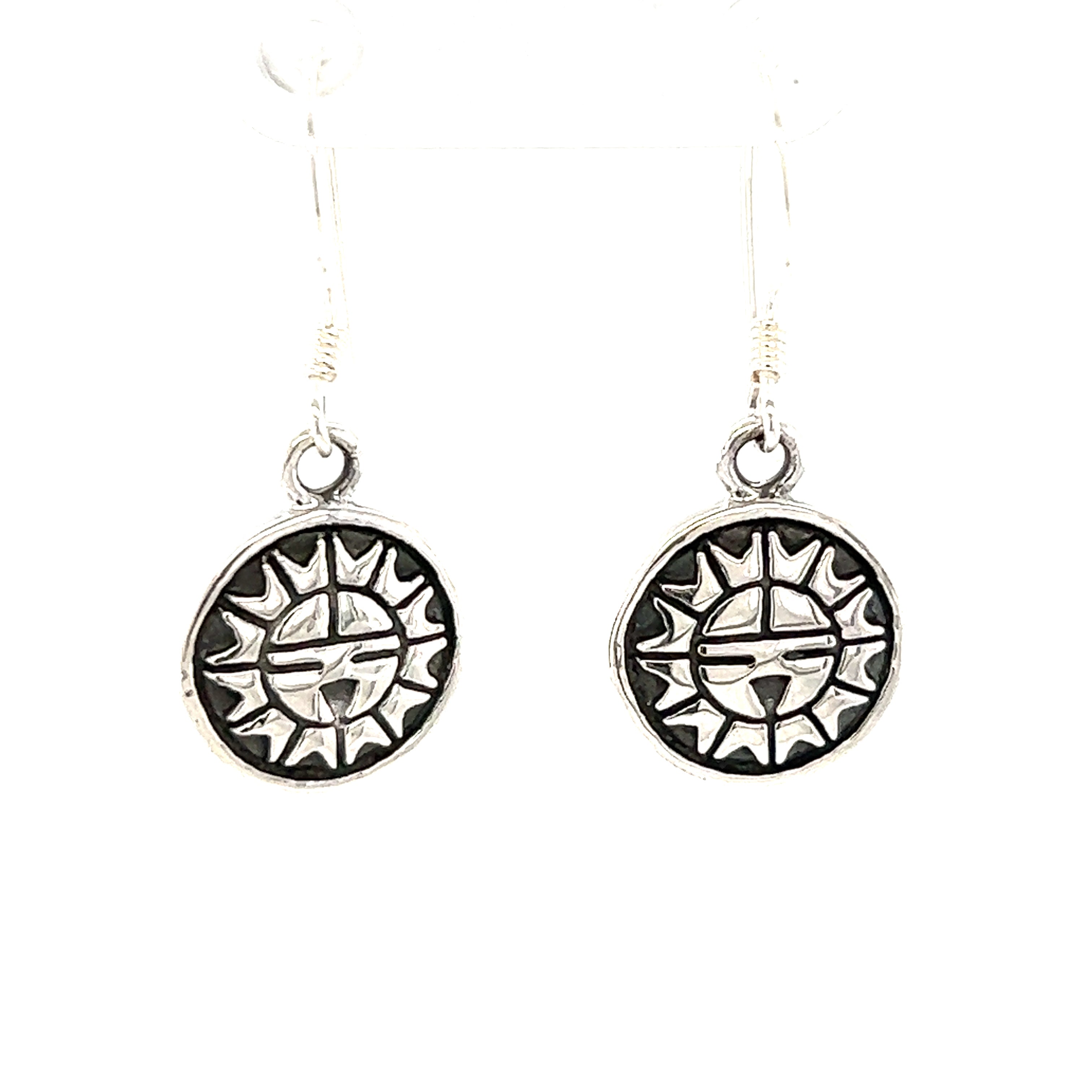 A pair of small Super Silver Tribal Sun Earrings on a white background.