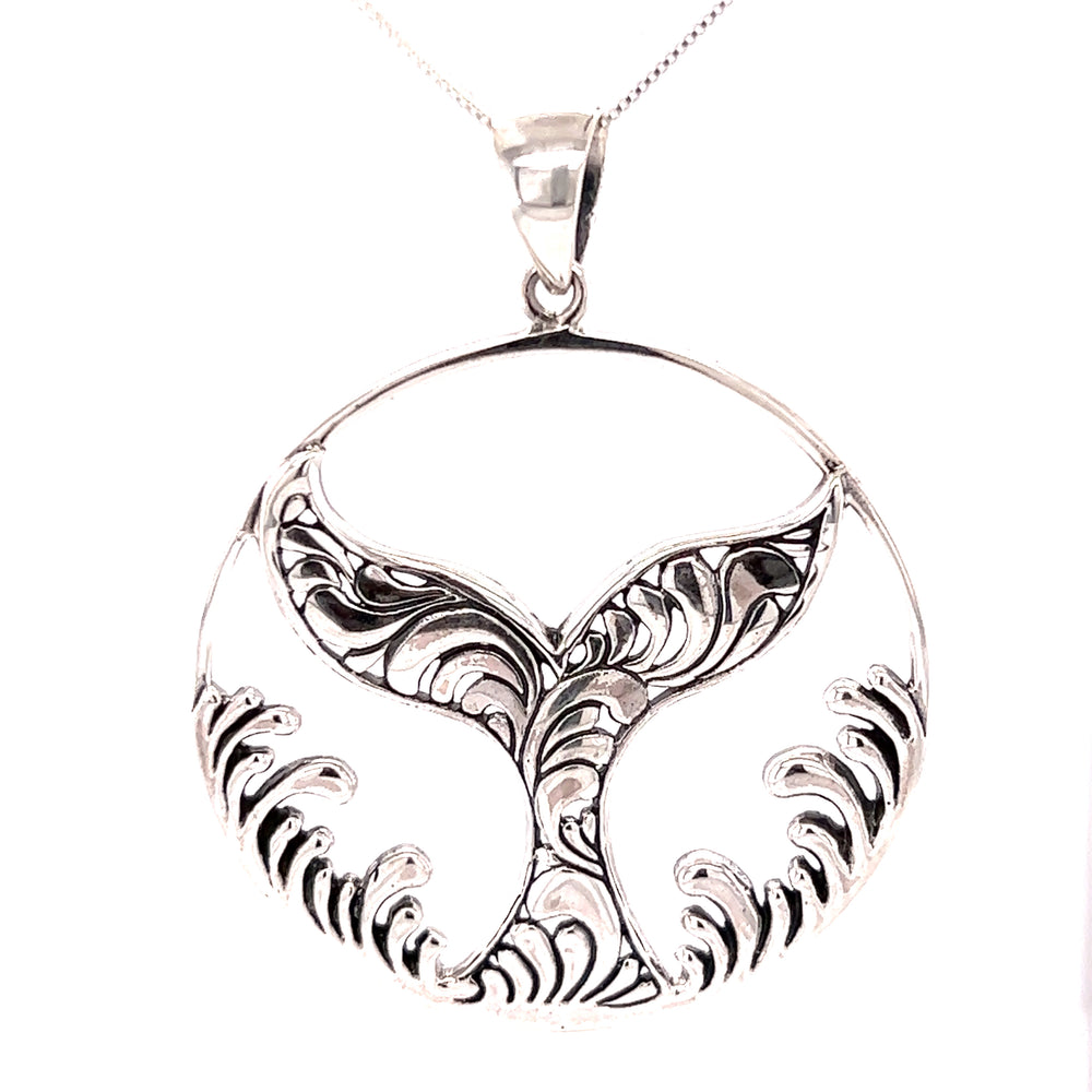 A Super Silver Magnificent Whale Tail Pendant with Waves, inspired by the ocean.