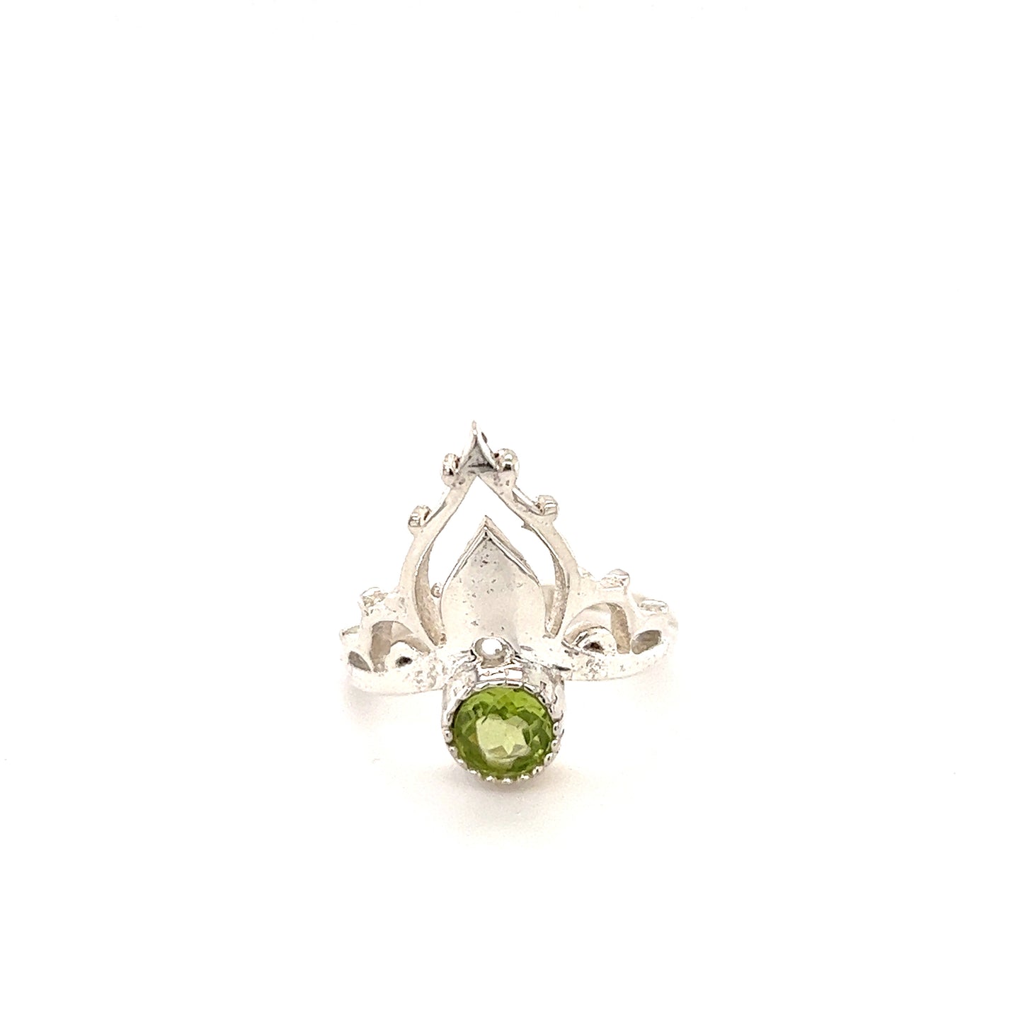 
                  
                    A Mandala Crown Ring with Natural Gemstones featuring a stunning peridot cabochon surrounded by sparkling diamonds.
                  
                