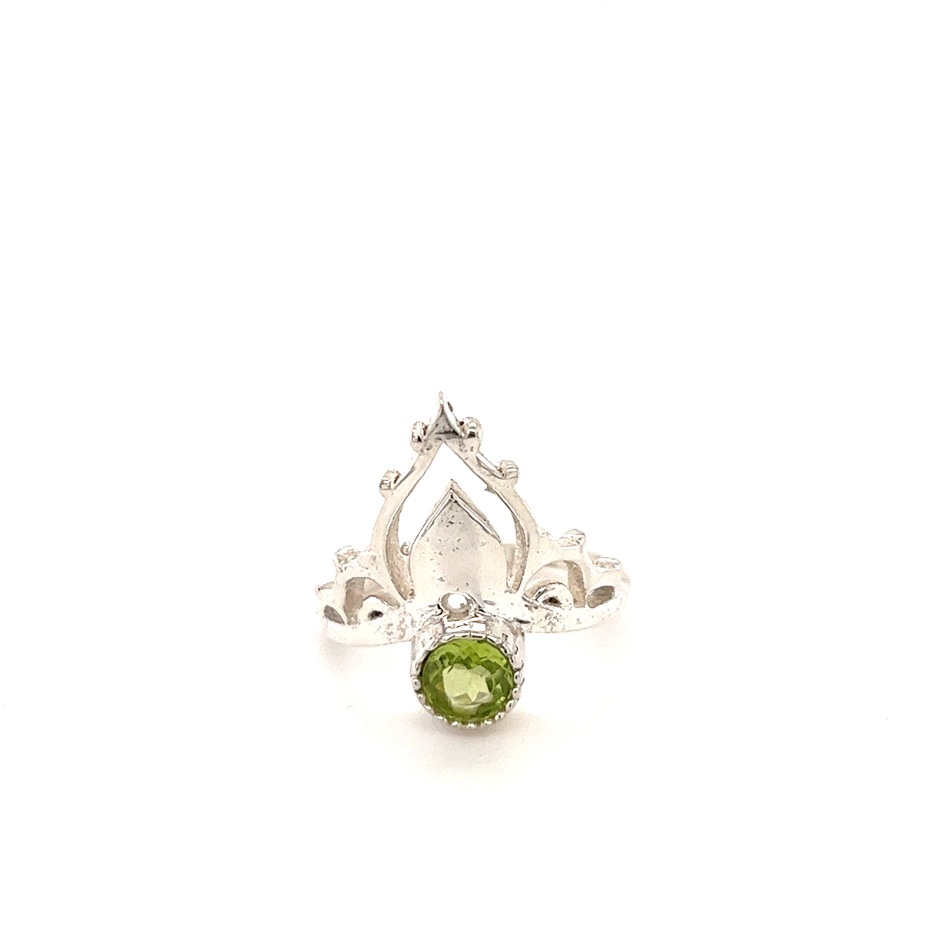 A Mandala Crown Ring with Natural Gemstones featuring a stunning peridot cabochon surrounded by sparkling diamonds.