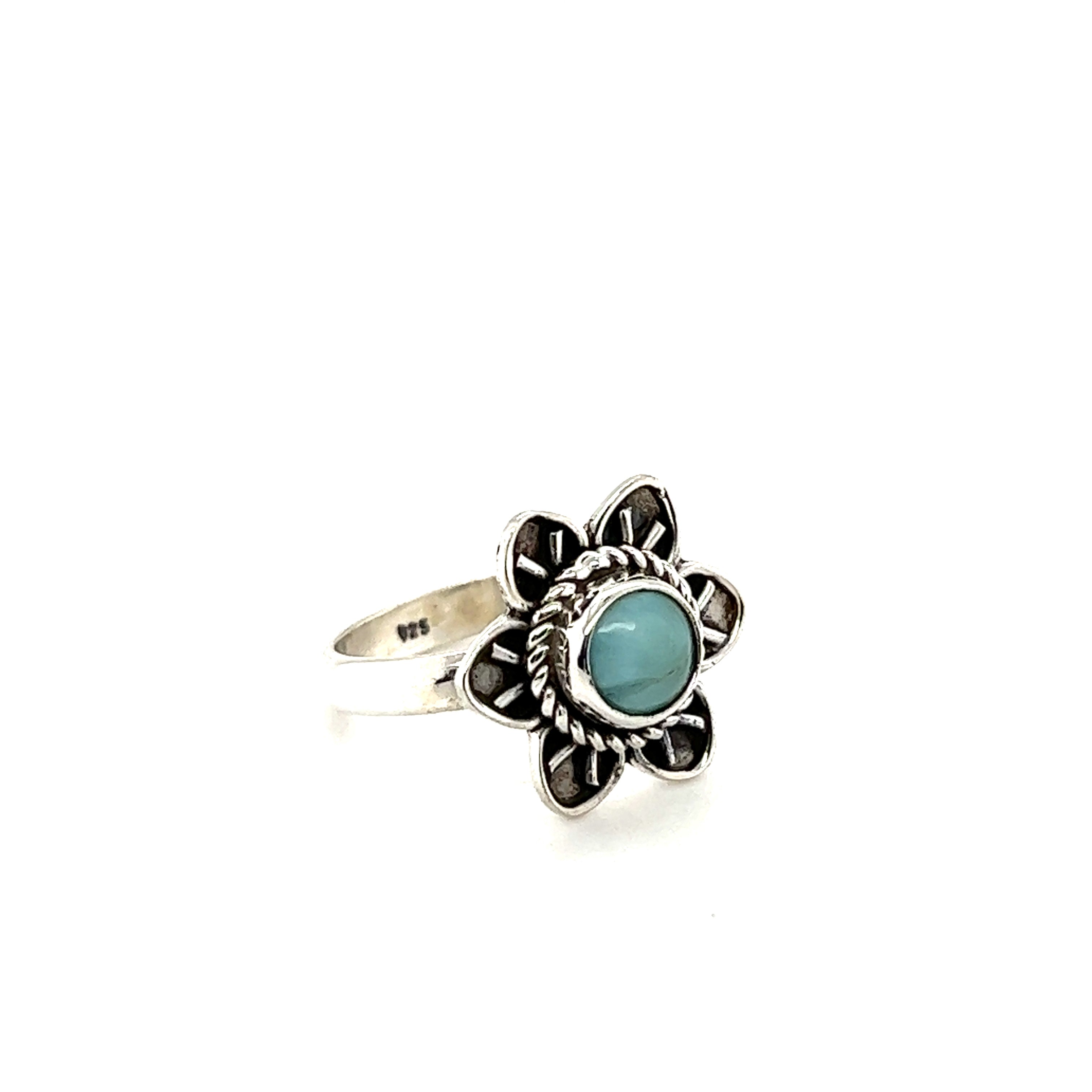 An Enchanting Flower Ring with Natural Gemstones from Super Silver, with silver petals and a turquoise gemstone.