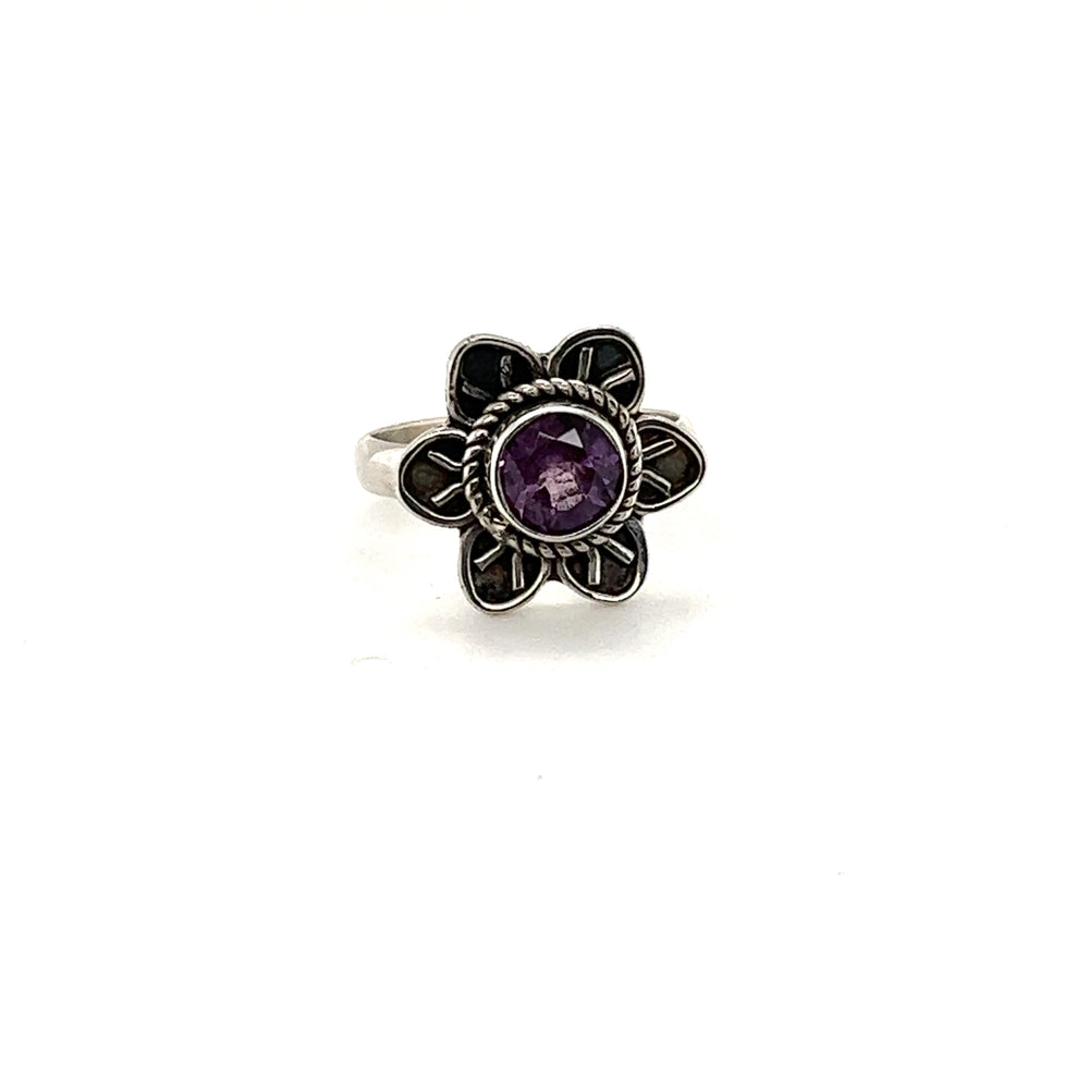 
                  
                    A stunning Enchanting Flower ring with natural gemstones and silver petals on a white background by Super Silver.
                  
                
