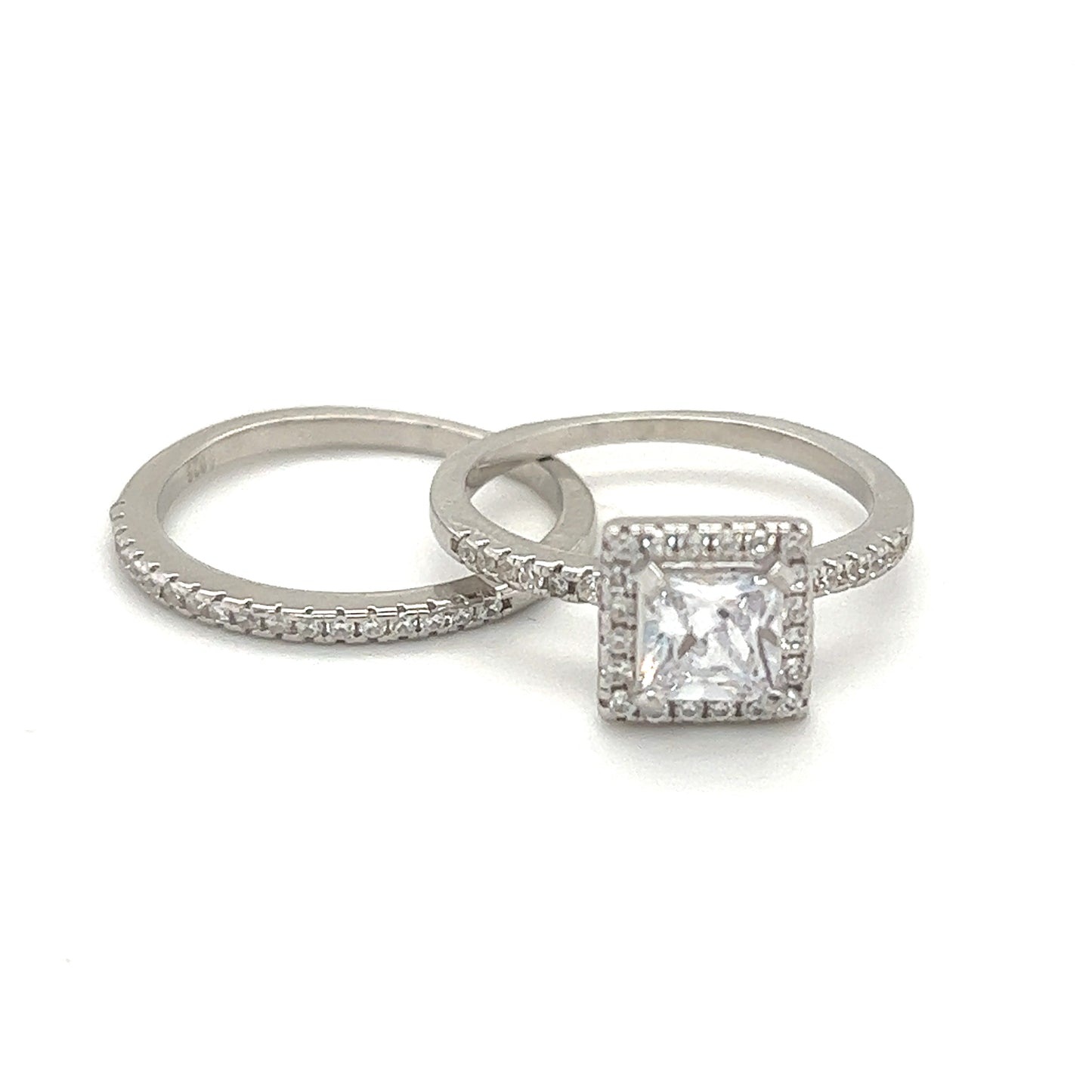 An elegant Princess Cut Cubic Zirconia Engagement Ring set with princess cut diamonds in white gold.