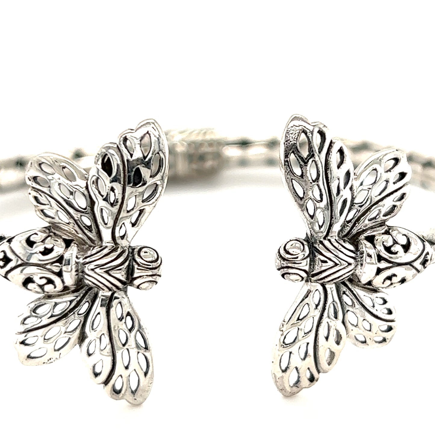 
                  
                    Super Silver presents a stunning pair of Exquisite Bee Cuff bracelets.
                  
                