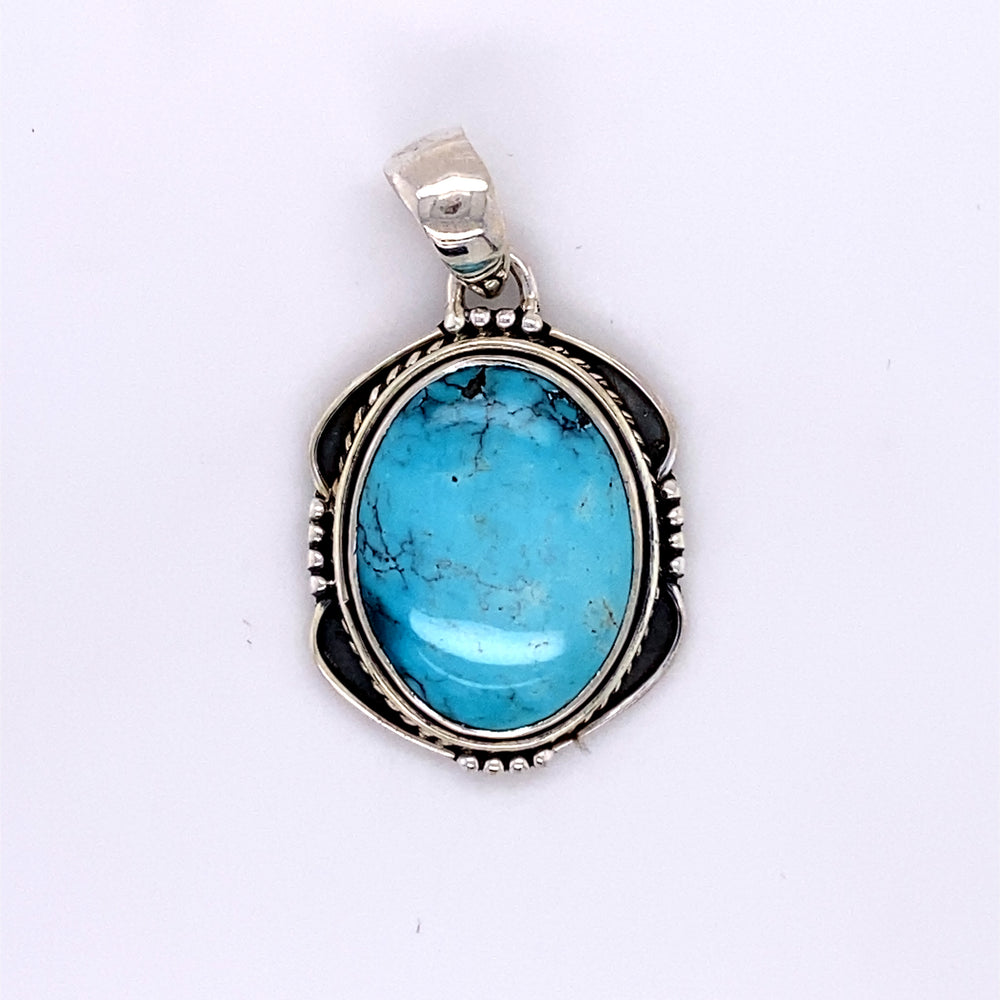 
                  
                    An Oval Shield Setting Natural Turquoise Pendant handmade in sterling silver by Super Silver.
                  
                