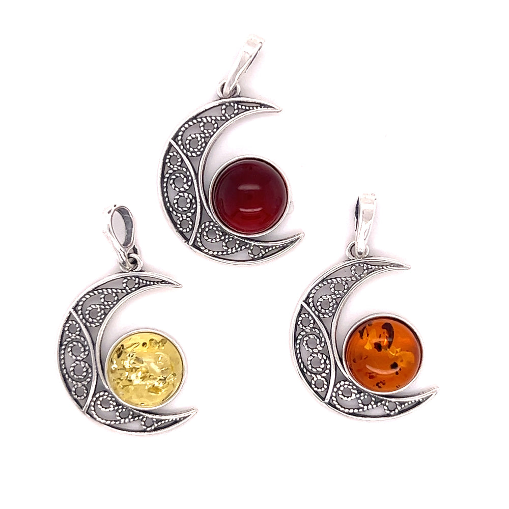 Three Baltic Amber Moon pendants with .925 Sterling Silver by Super Silver.