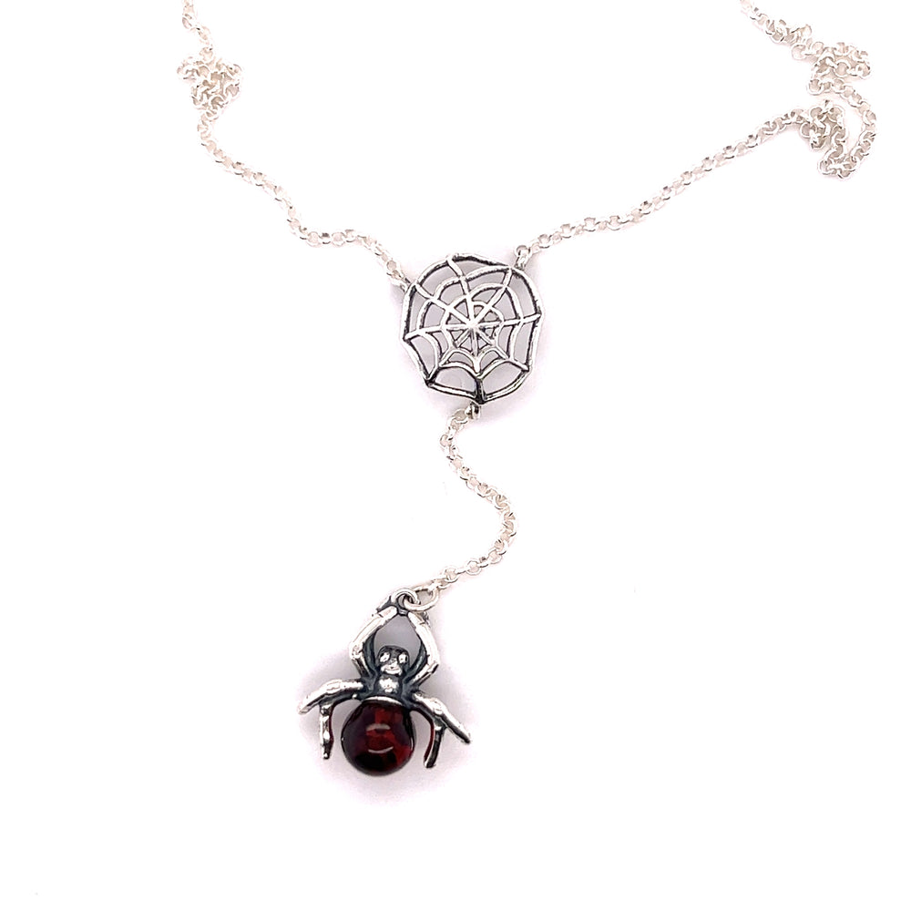 
                  
                    A Super Silver Baltic Amber Spider Necklace adorned with a Baltic amber bead.
                  
                