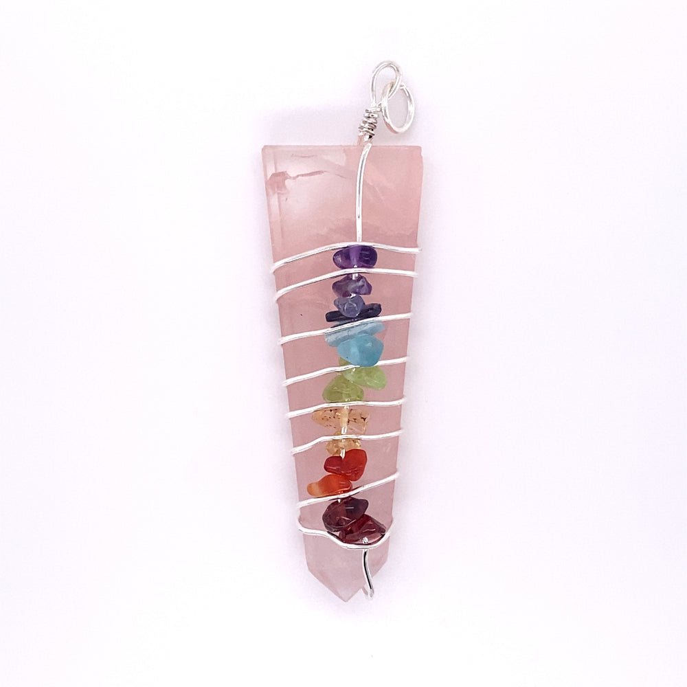 
                  
                    A pink quartz necklace with seven Stone Slab Wire-Wrapped Chakra Pendants hanging from crystal pendants by Super Silver.
                  
                