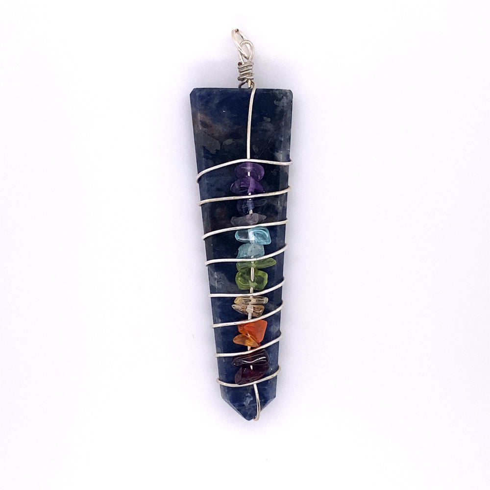 
                  
                    A Stone Slab Wire-Wrapped Chakra Pendant with seven chakras hanging from it, adorned with chakra stones by Super Silver.
                  
                