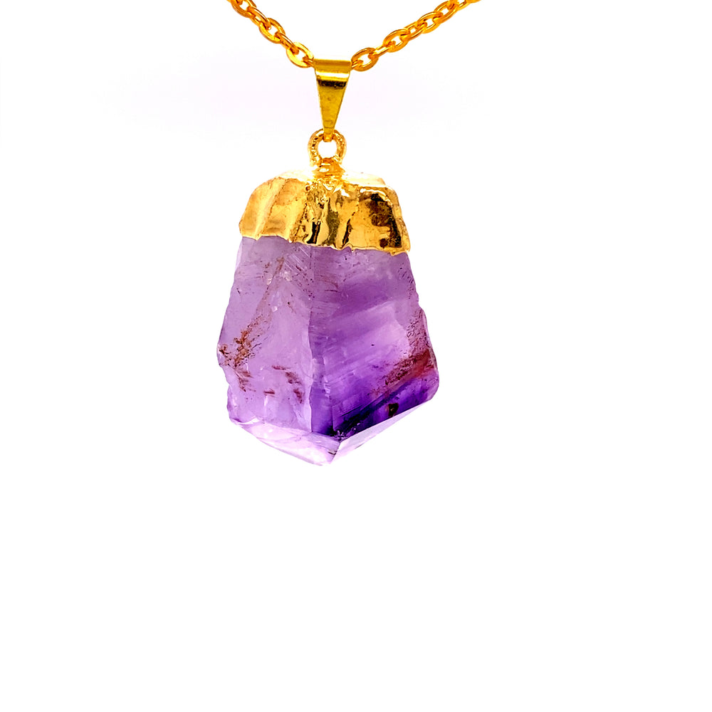 
                  
                    A Super Silver Raw Crystal Pendant With Gold Cap on a gold chain.
                  
                