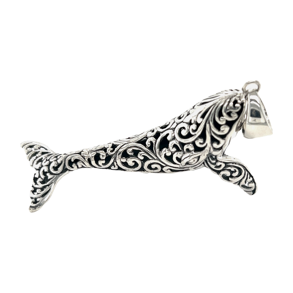 
                  
                    An ornate Super Silver Magnificent Filigree Whale Pendant on a white background.
                  
                