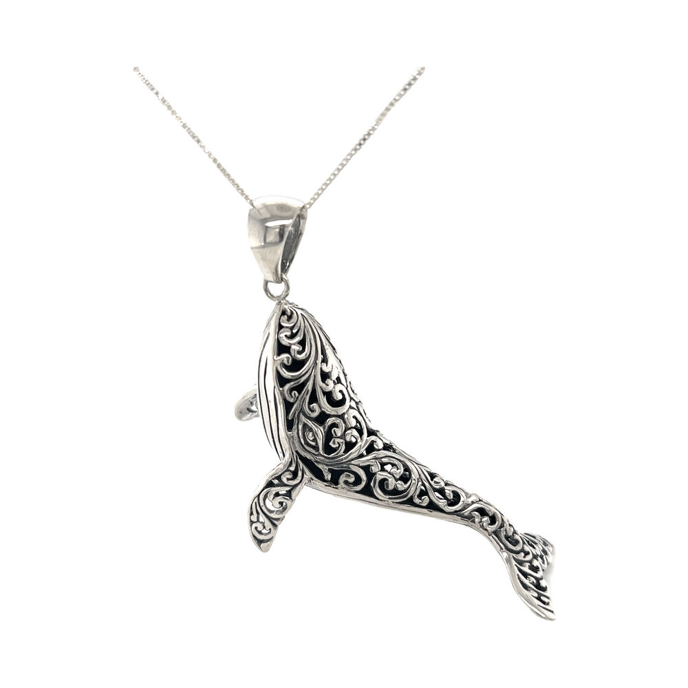A Super Silver Magnificent Filigree Whale Pendant with a delicate filigree design reminiscent of the ocean.