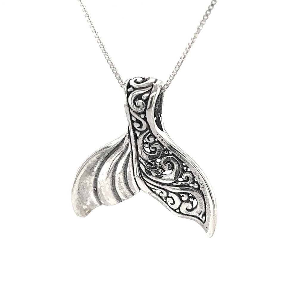
                  
                    An Elegant Half Filigree Whale Tail Pendant necklace from Super Silver, perfect for ocean lovers enamored with Santa Cruz.
                  
                