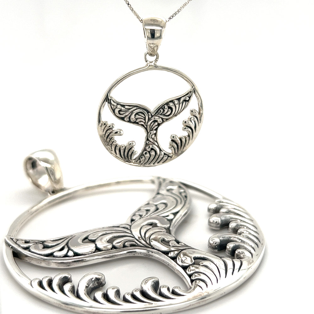 
                  
                    A Dazzling Circular Whale Tail Pendant with a whale tail, inspired by the oceanic beauty of Santa Cruz, made by Super Silver.
                  
                
