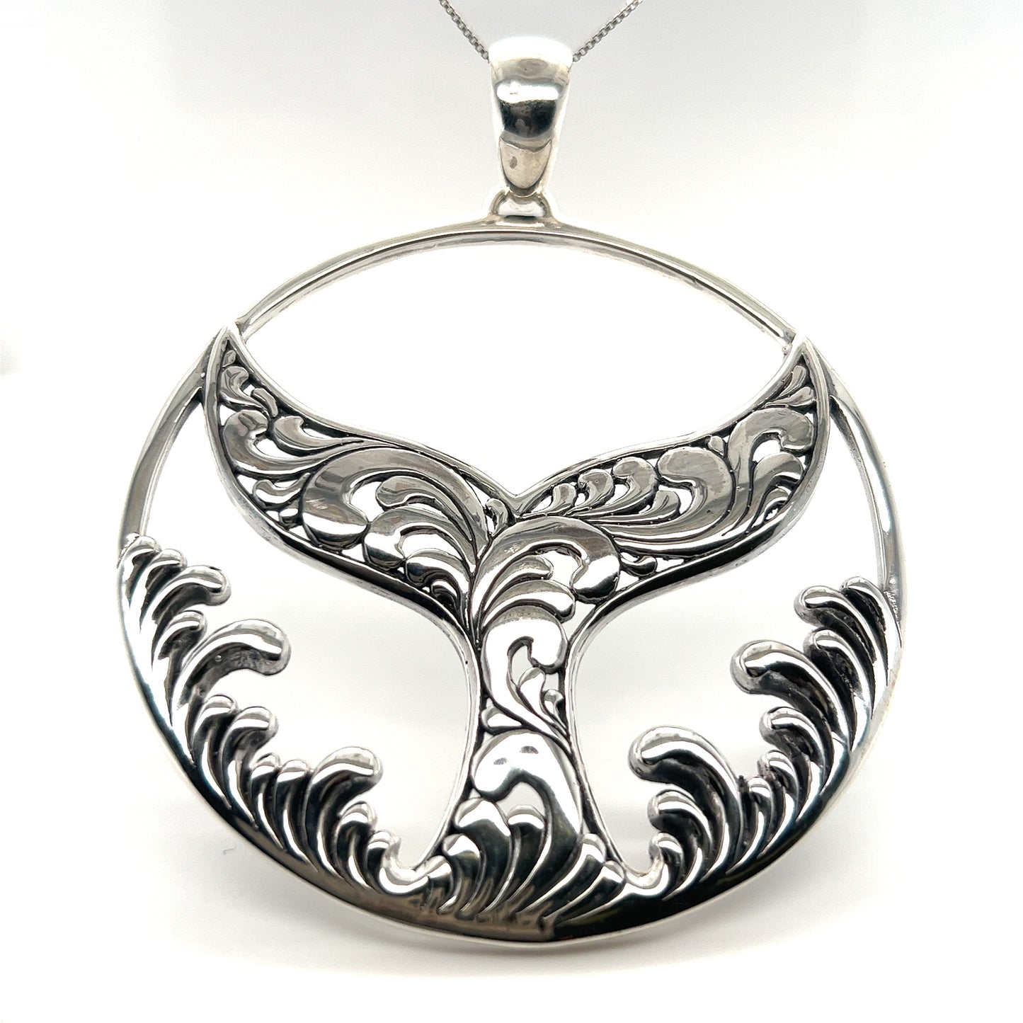 A Extravagant Whale Tail Pendant with a sterling silver pendant, perfect for ocean lovers and those with a connection to Santa Cruz, by Super Silver.