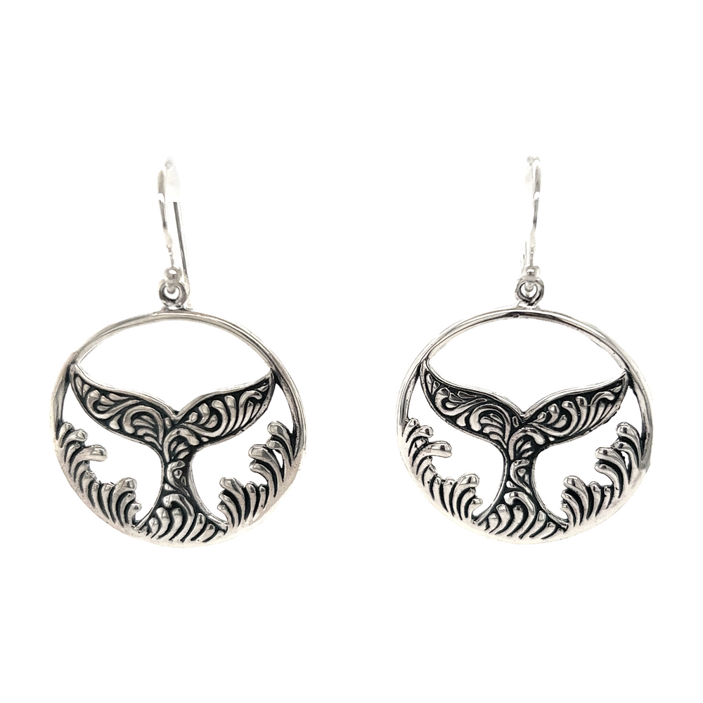 A pair of Super Silver Enchanting Filigree Whale Tail earrings.