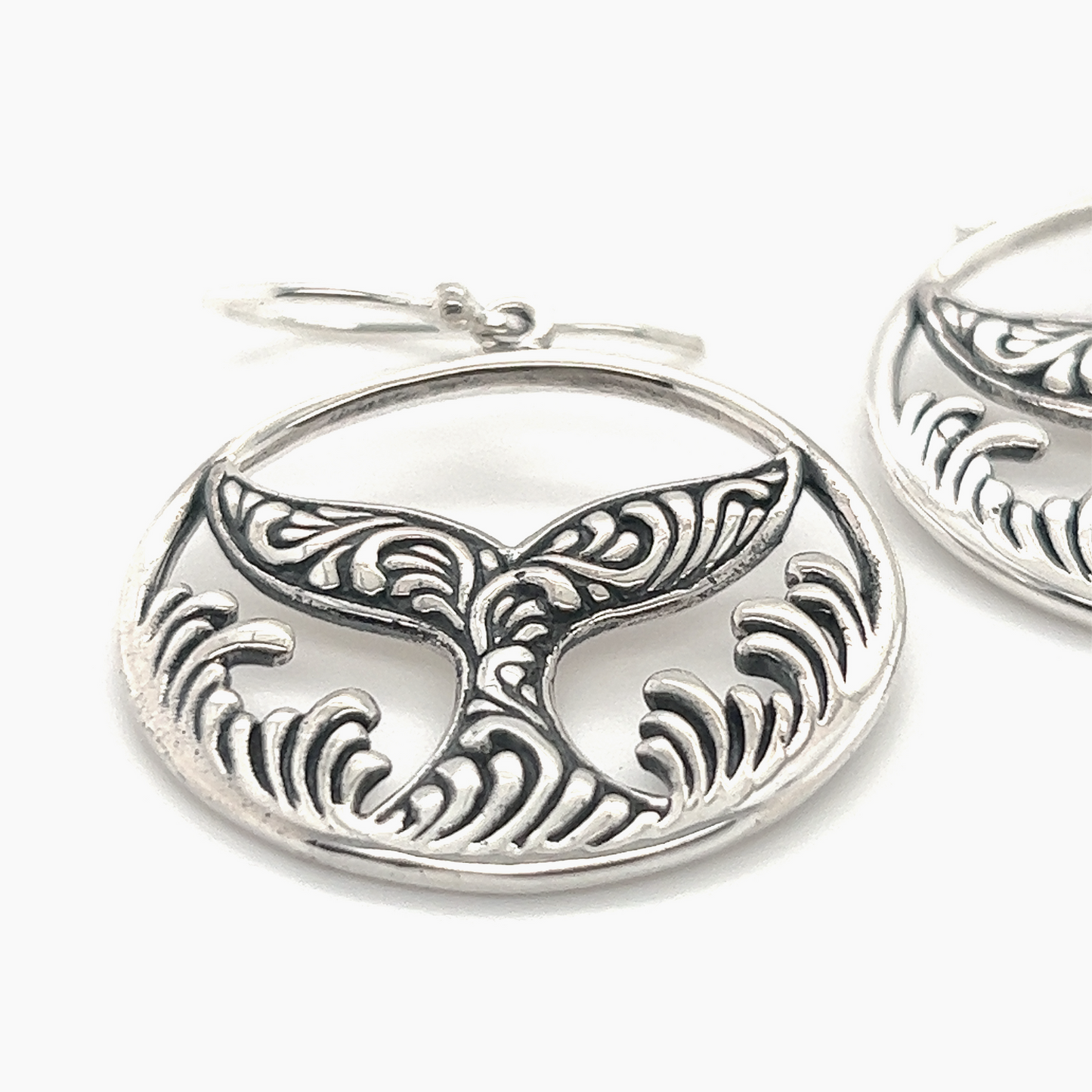 
                  
                    A pair of Enchanting Filigree Whale Tail Earrings by Super Silver, perfect for ocean lovers in Santa Cruz.
                  
                