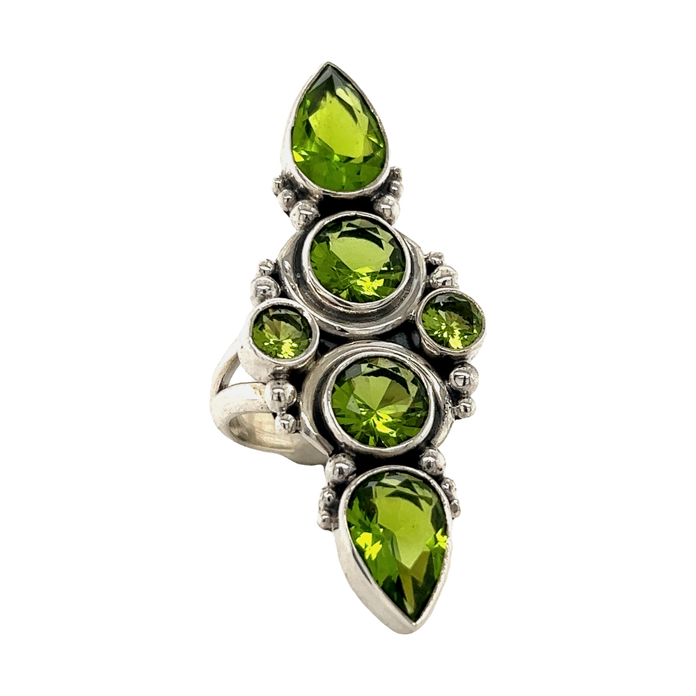 An Exquisite Peridot Statement Ring by Super Silver, adorned with peridot stones.