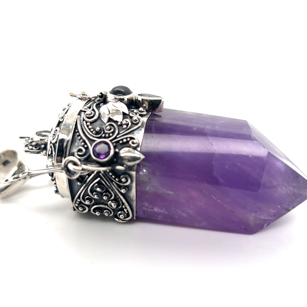 
                  
                    A Phenomenal Amethyst Poison Pendant featuring an amethyst crystal pendant on a Super Silver sterling silver chain.
                  
                