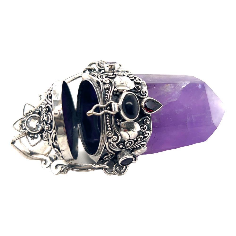 A stunning Super Silver Phenomenal Amethyst Poison Pendant with a vibrant purple stone.