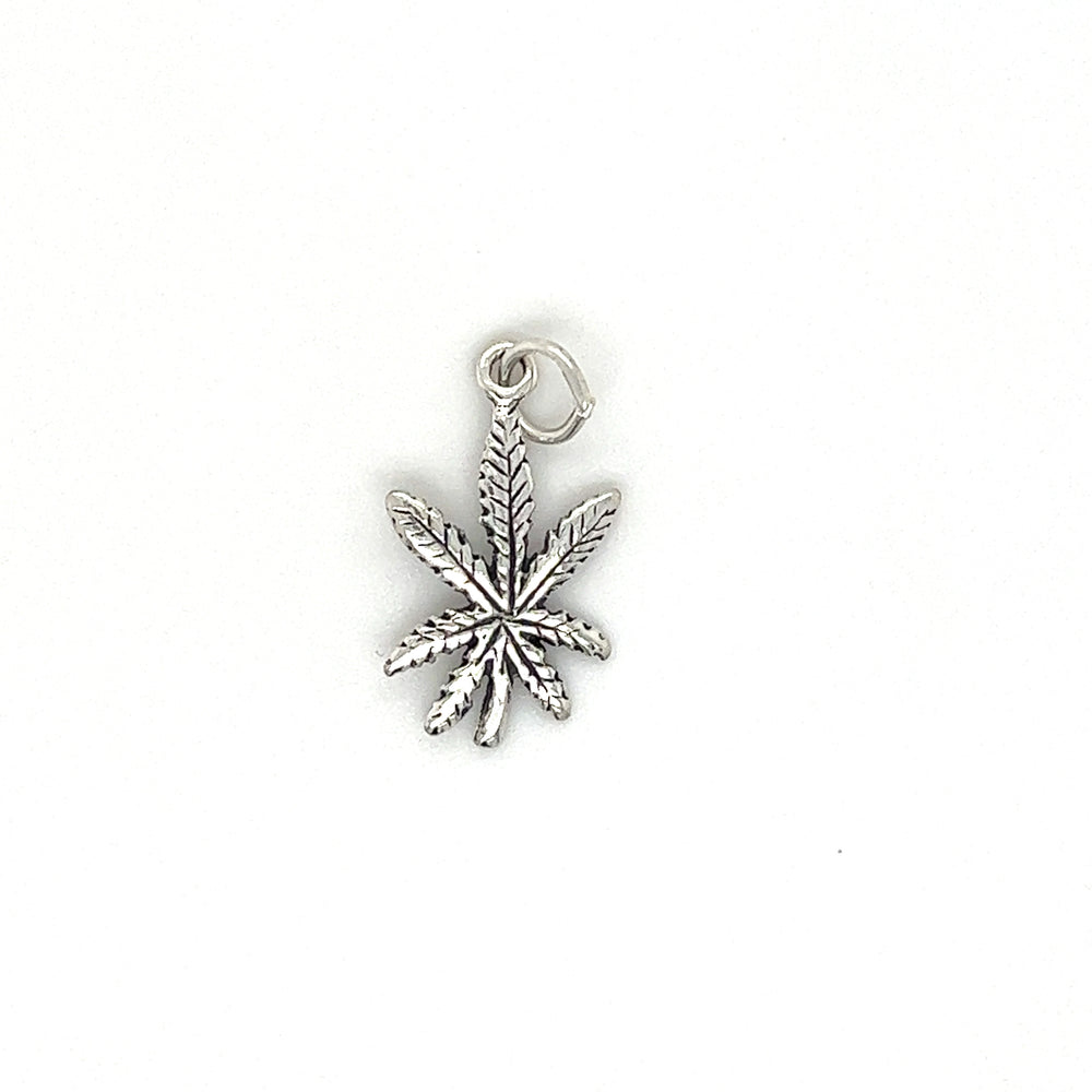 A Super Silver Tiny Mary Jane Leaf Charm on a white background.