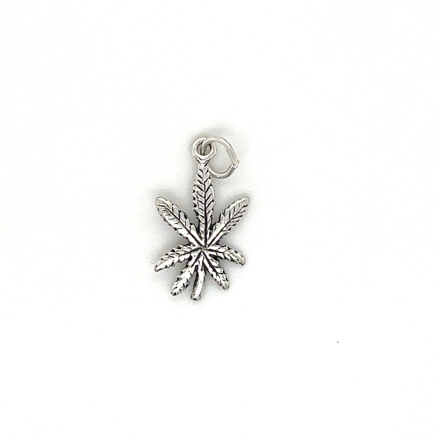 A Super Silver Tiny Mary Jane Leaf Charm on a white background.