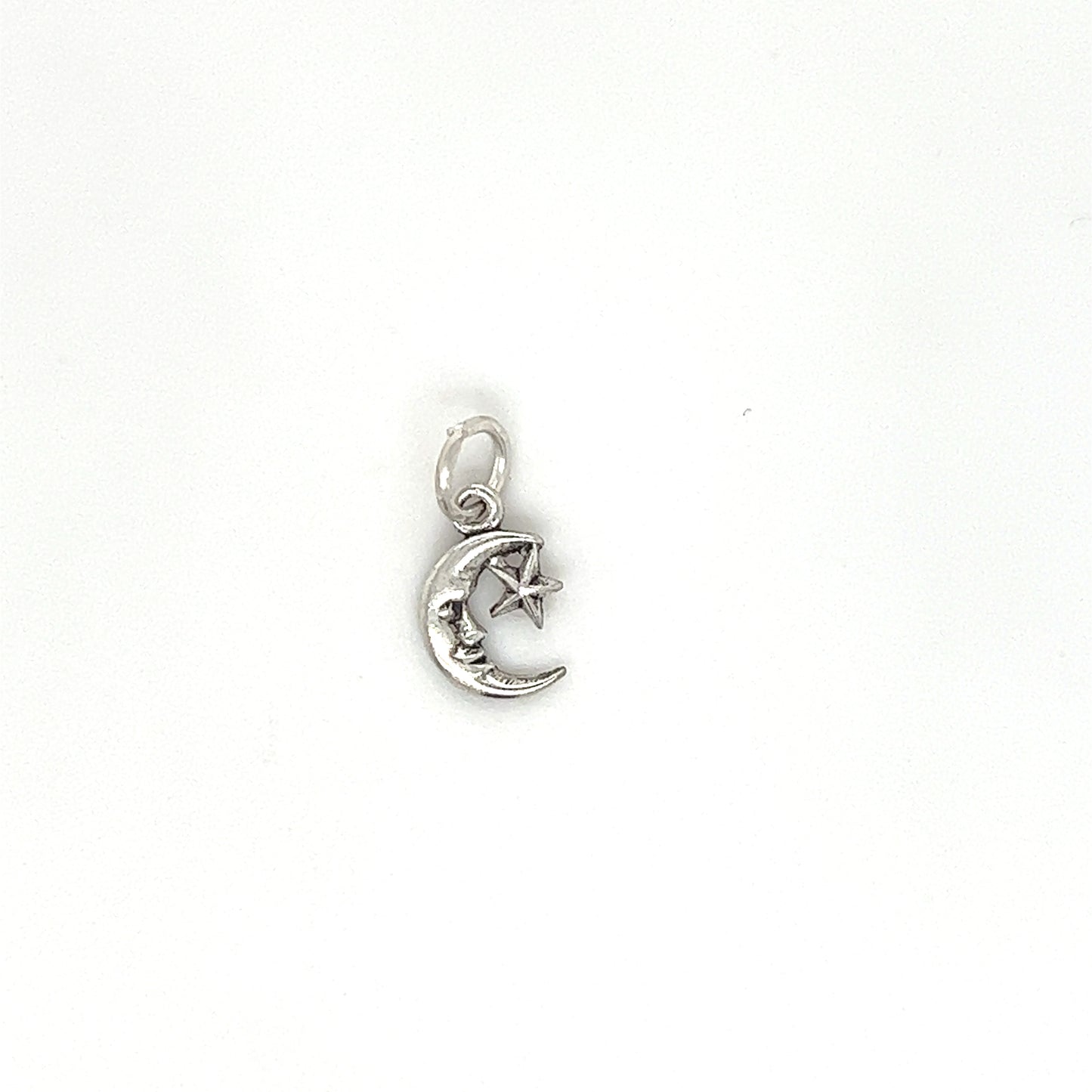 
                  
                    A Tiny Man in the Moon Star Charm on a white background, perfect for sky lovers and charm bracelet enthusiasts, made by Super Silver.
                  
                