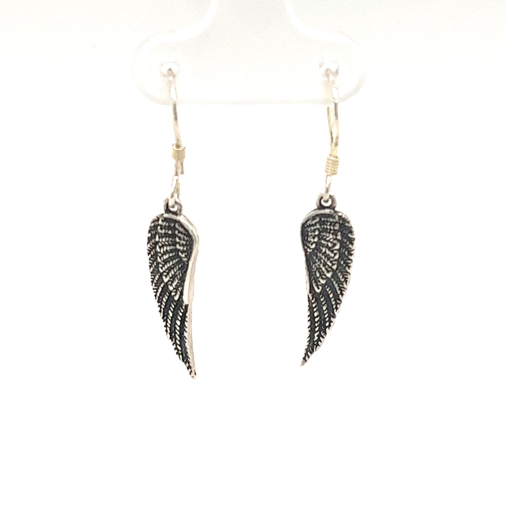 A celestial pair of Super Silver's Charming Wing Earrings on a white background.