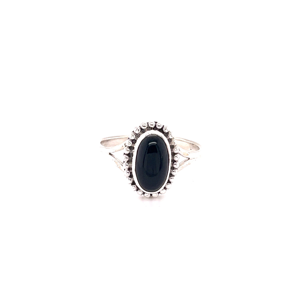 
                  
                    A stylish oval gemstone ring with a ball border on a white background.
                  
                
