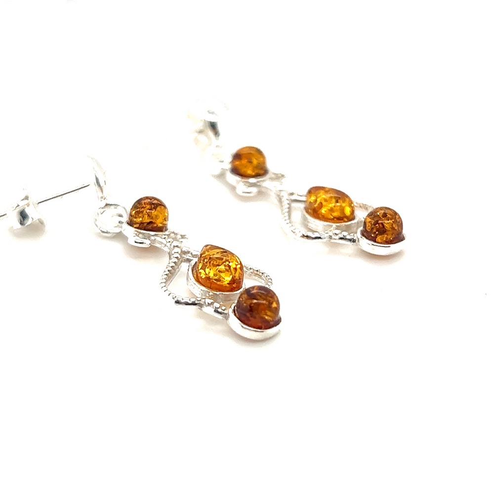 
                  
                    Super Silver's Exquisite Baltic Amber Scroll Earrings.
                  
                