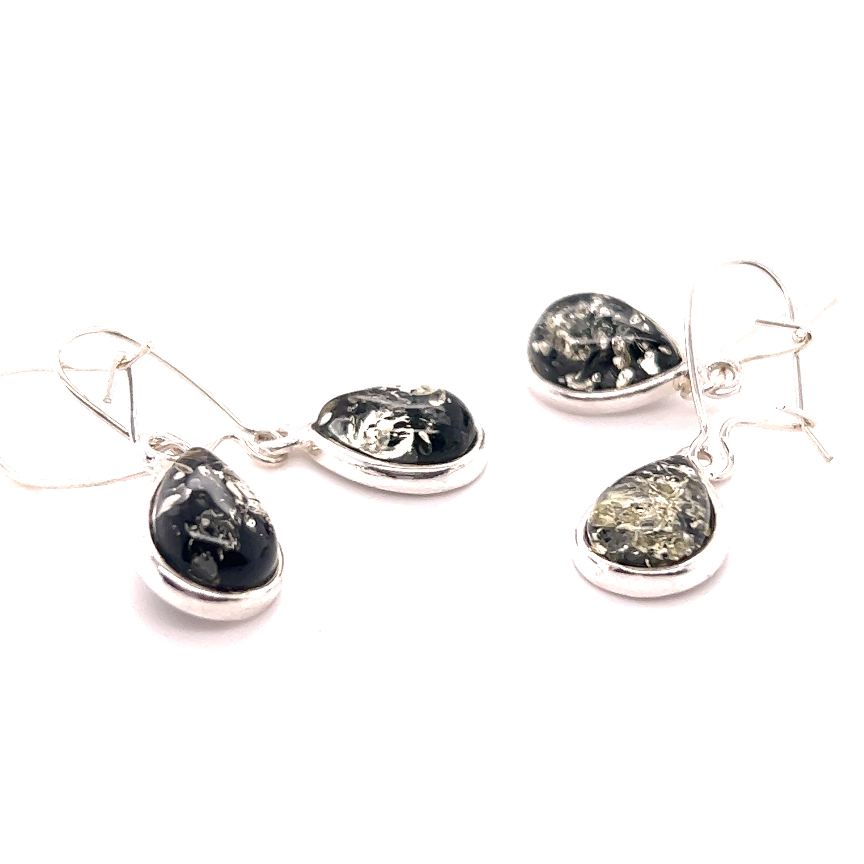A pair of Charming Baltic Amber Teardrop Earrings by Super Silver with sparkling black and white stones.
